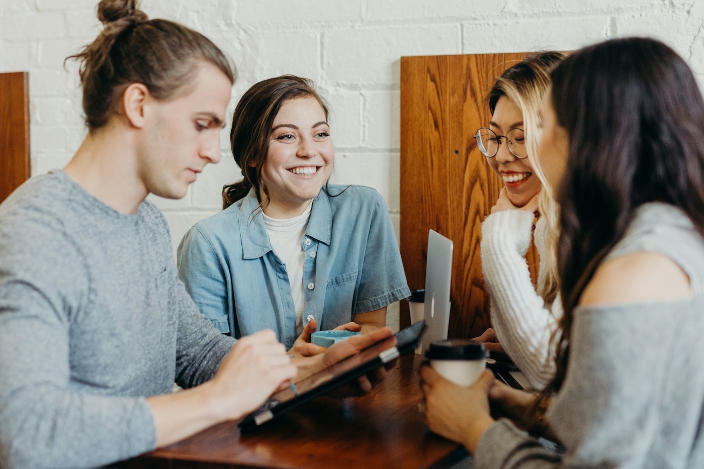 Young professionals sharing ideas around a table
